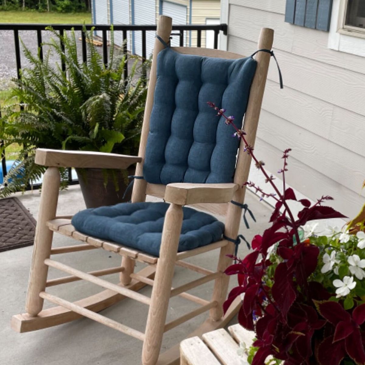 blue outdoor rocker cushions on the front porch
