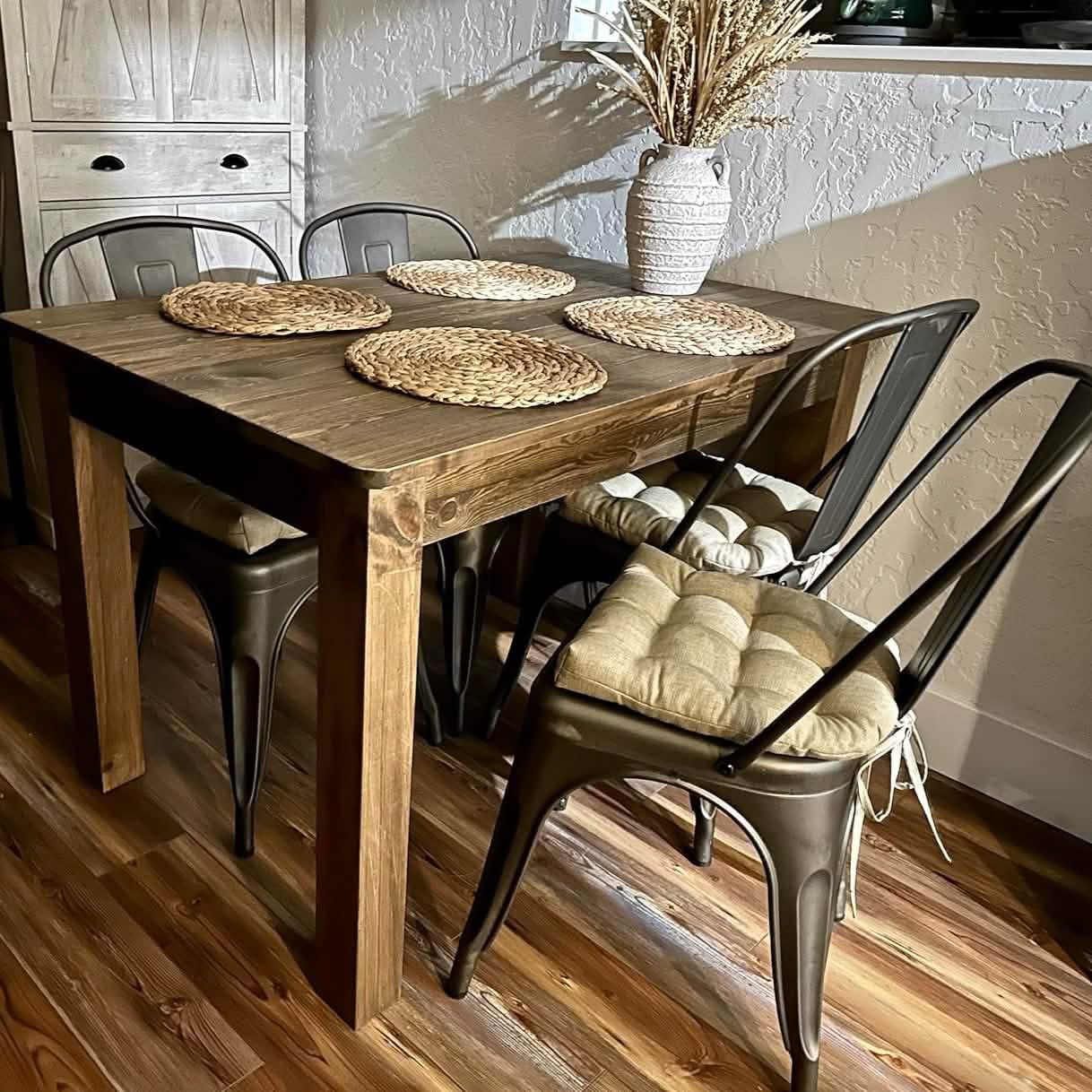 neutral colored tolix chair pads with metal chair cushions in farmhouse kitchen