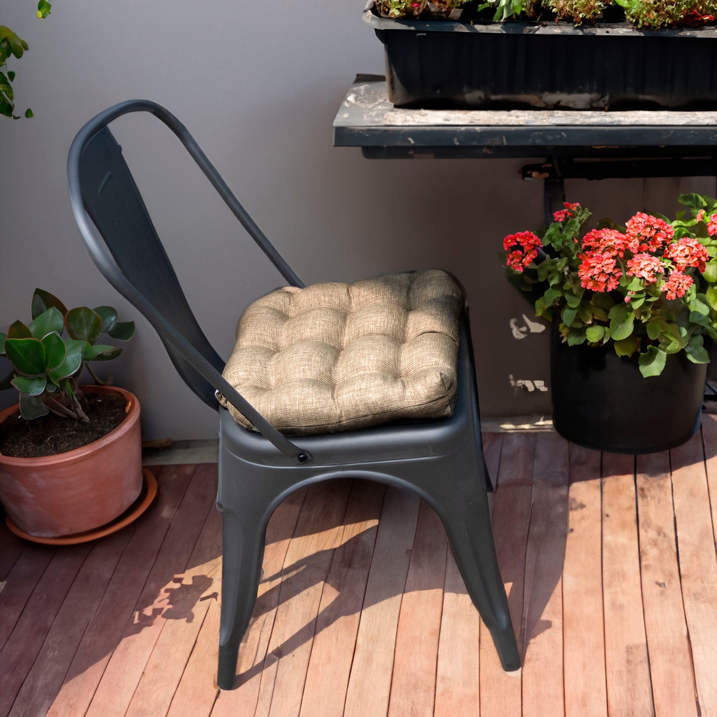 neutral colored outdoor cushion on metal tolix chair outside on the patio