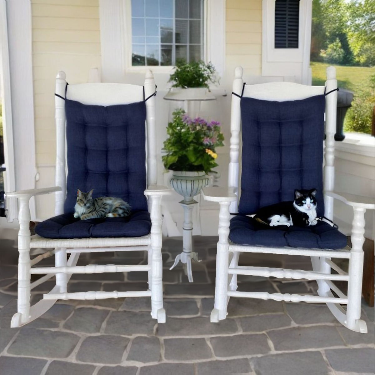 navy blue outdoor rocker cushions on white rocking chairs on the patio