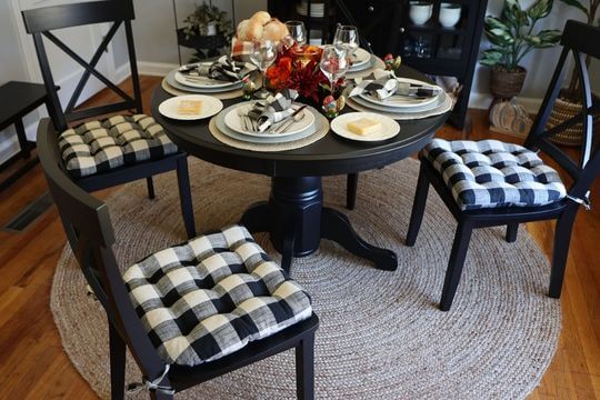 Buffalo check dining chair cushions in a formal dining room