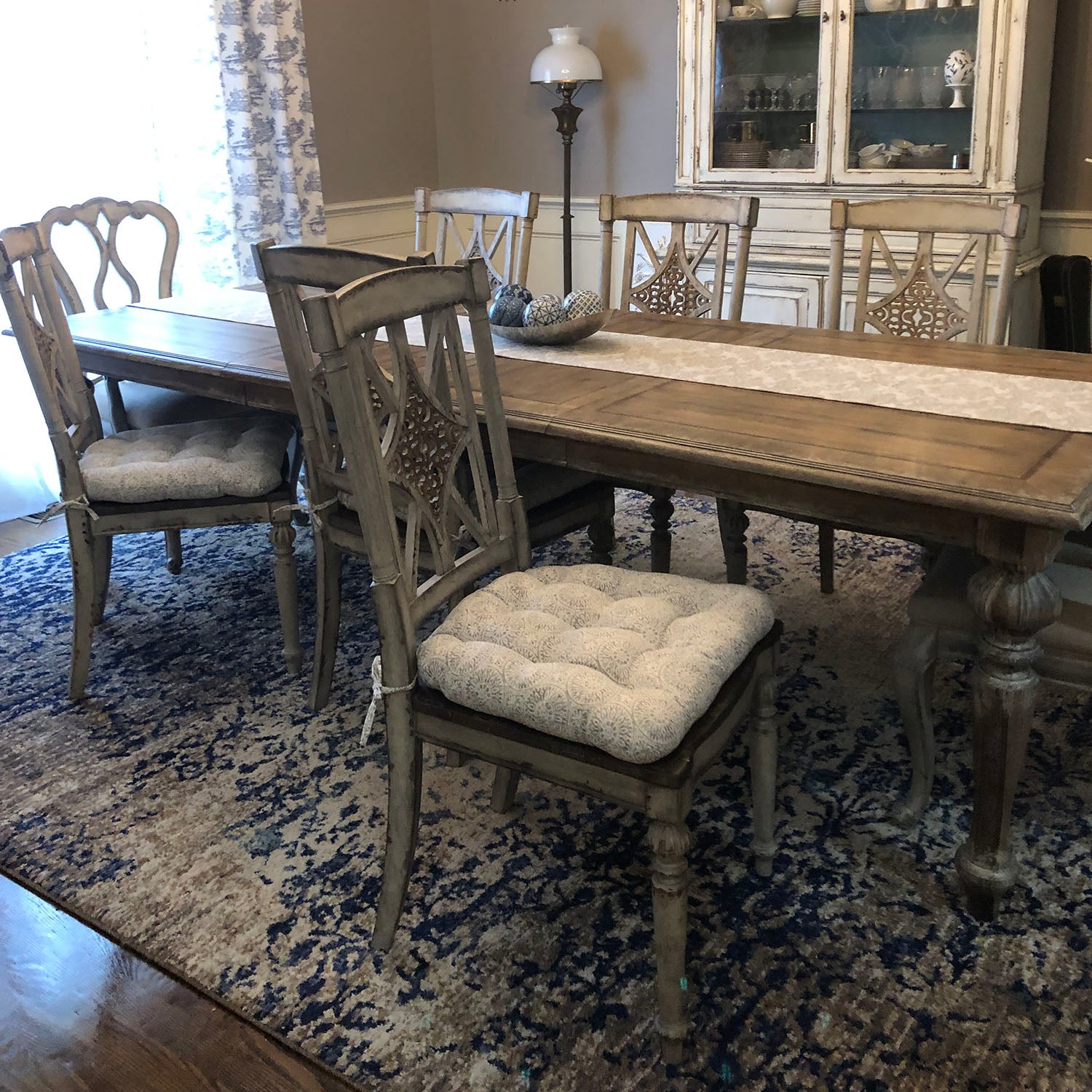 grey dining chair pads in a formal dining room with traditional dining table and chairs