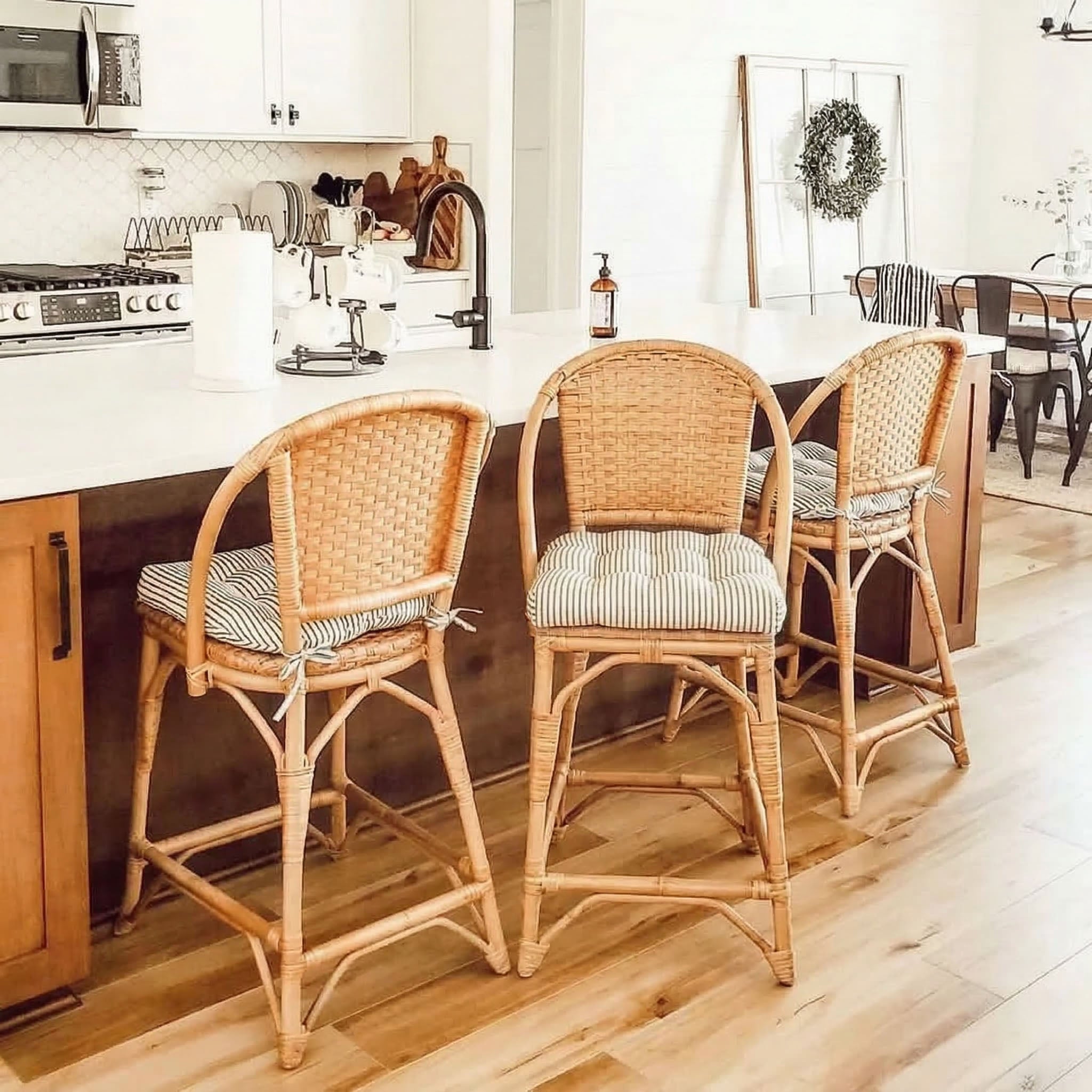 black ticking stripe barstool cushions on bar height chairs at the kitchen island