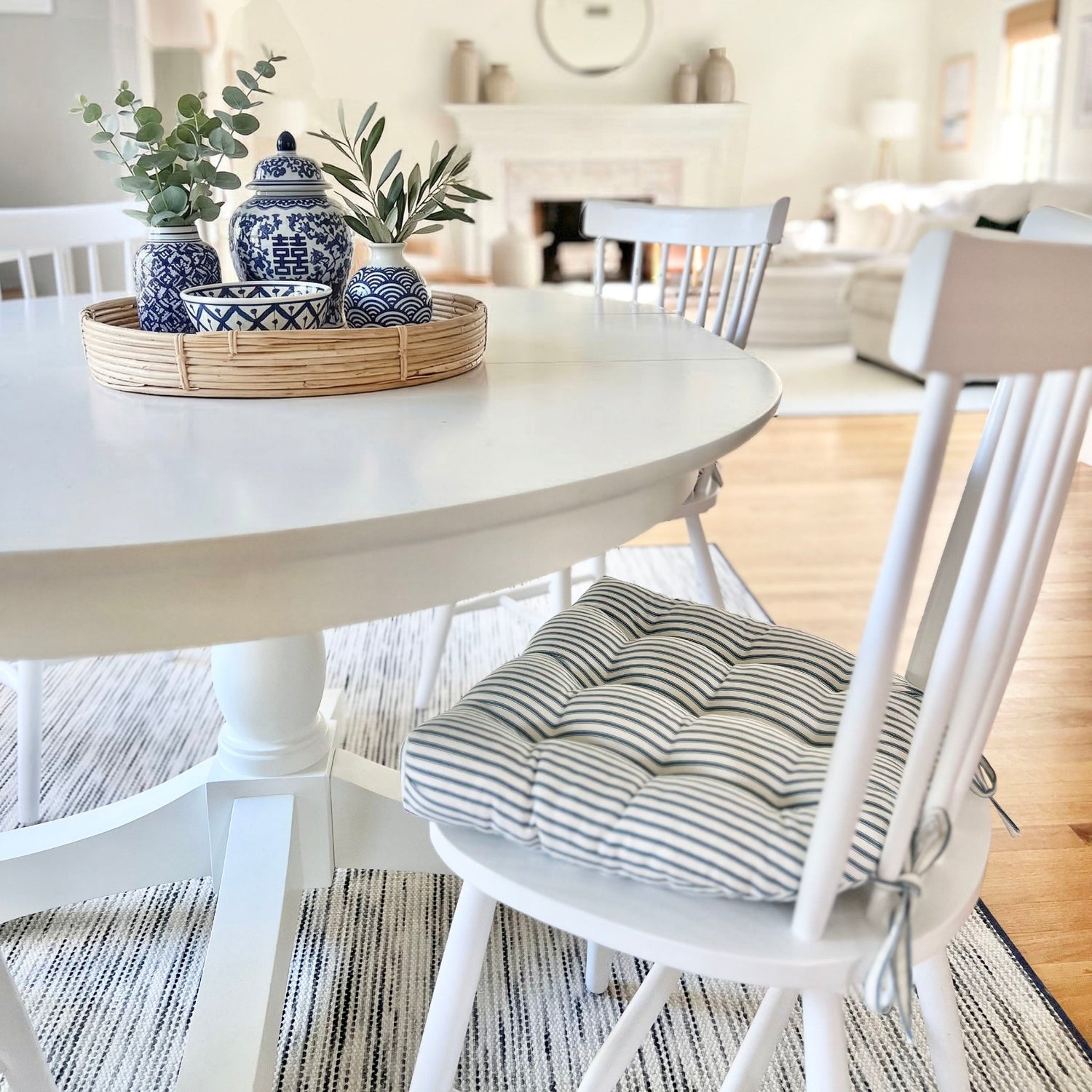 navy blue ticking stripe dining chair cushions at white dining room table