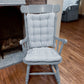 light blue ticking stripe rocker cushions on a colonial blue rocking chair in a traditional living room