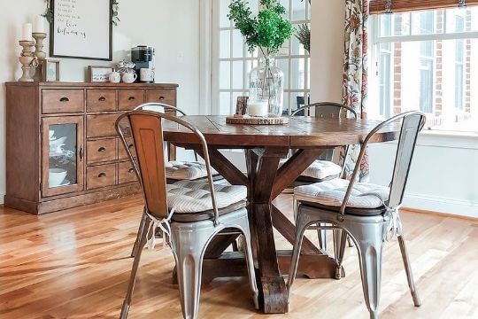 tolix chair cushions on metal chairs in farmhouse dining room with pottery barn dining table