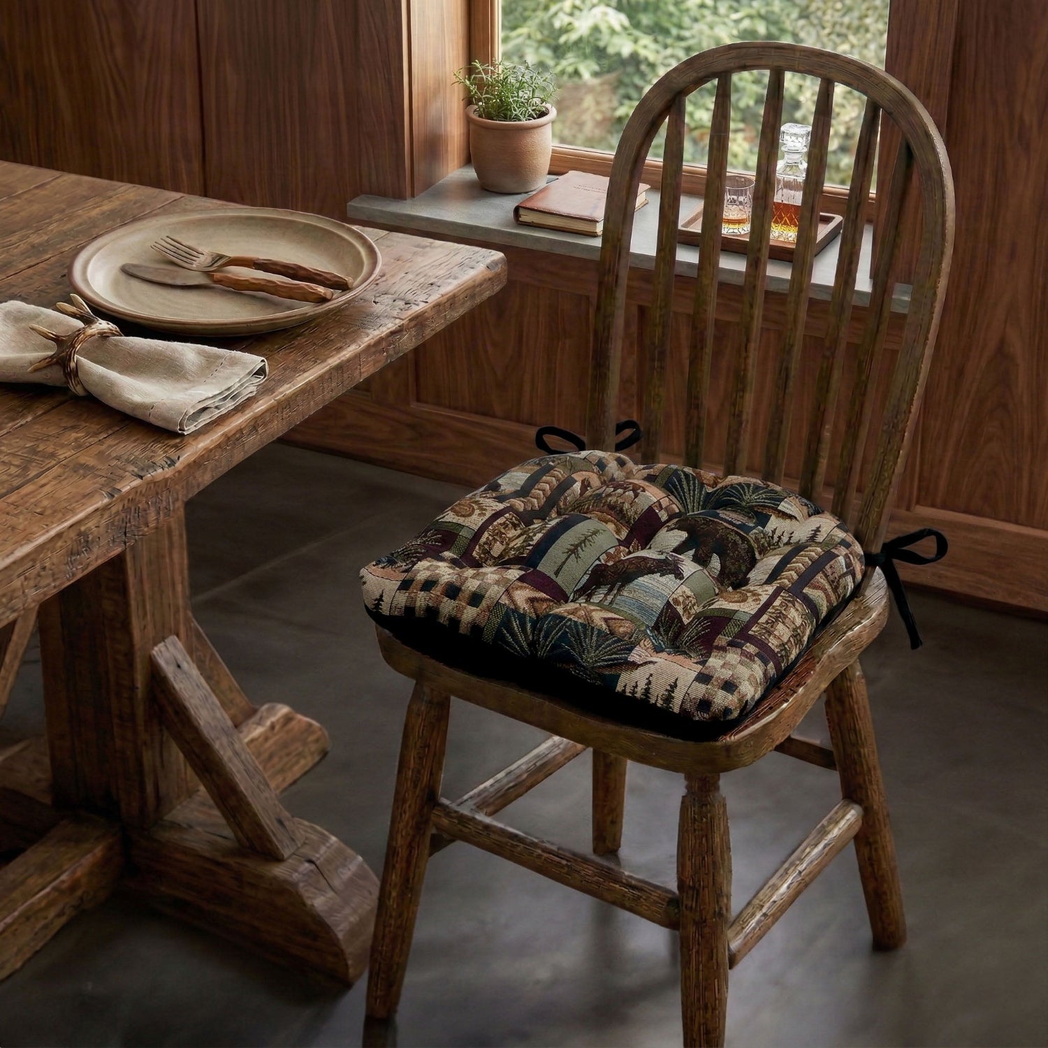 bear chair cushions in log cabin dining room with moose and pine cones