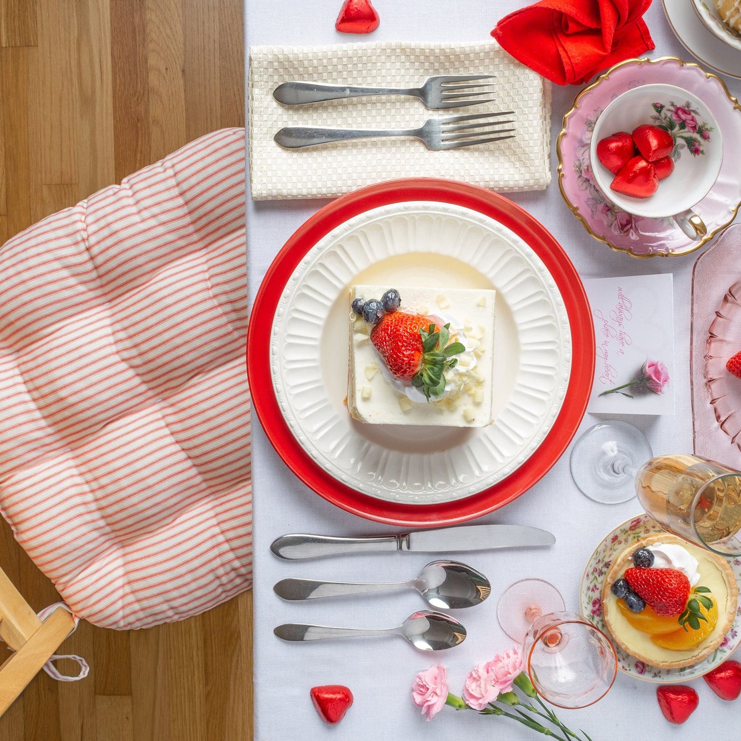 french ticking chair pads in red and ivory with valentines brunch table decorations