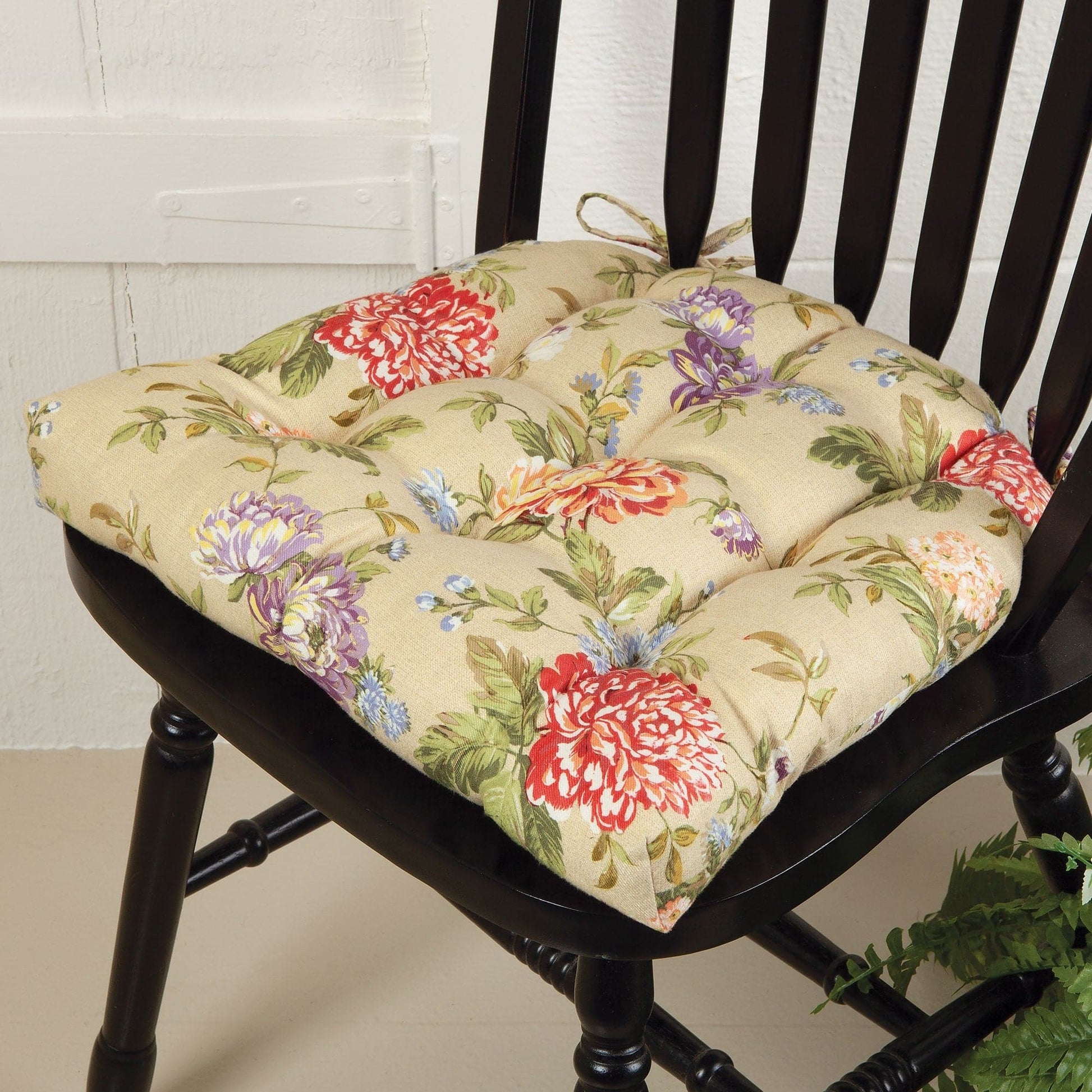 floral dining chair pad from sturbridge yankee with red and purple flowers on beige background