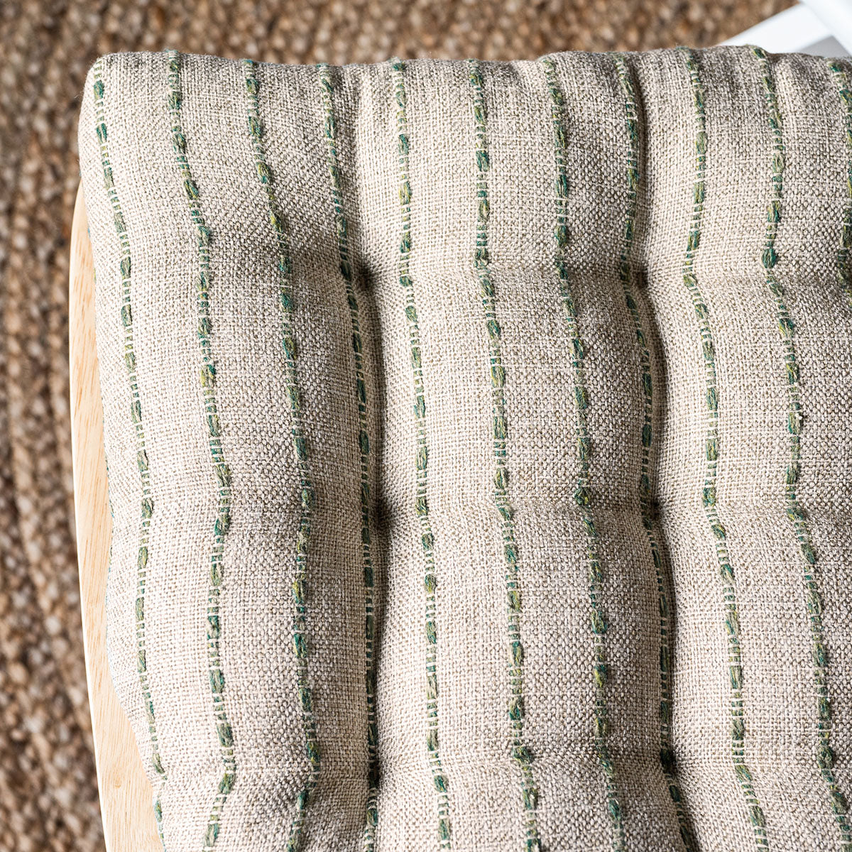 detail view of oatmeal and green striped cushions closeup