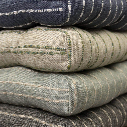Stack of avante chair pads in navy blue green spa and charcoal black color options