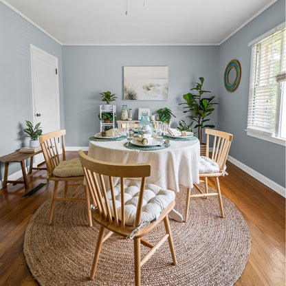 natural cotton basket weave dining room chair cushions with ties on spindle back dining chairs in coastal dining room