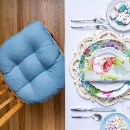 blue cotton chair pad on dining room chair at easter place setting