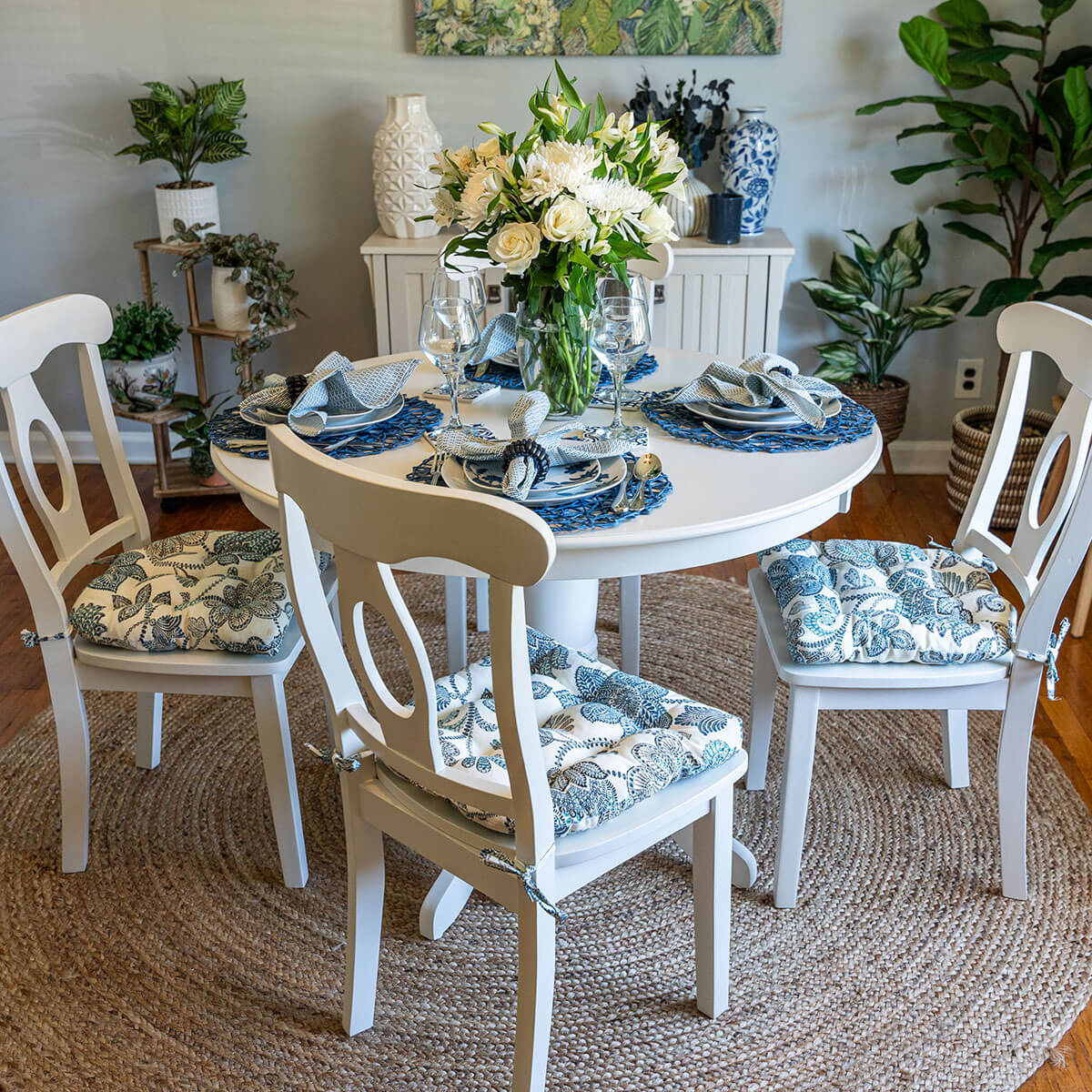 blue floral dining chair cushions in transitional dining room on white dining chairs