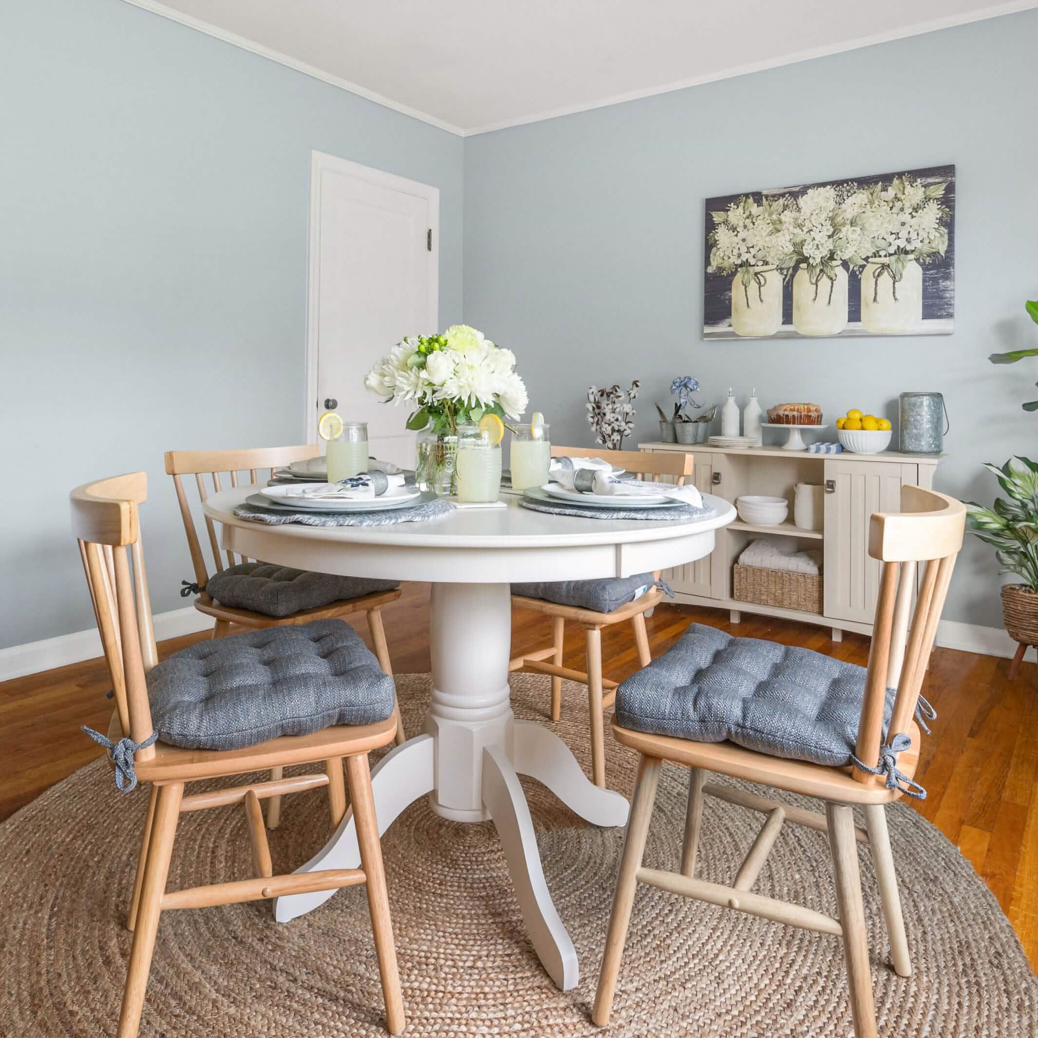 farmhouse dining chair cushions in slate blue in country kitchen with mason jars and lemons
