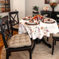 tan dining chair cushions in formal dining room decorated for fall