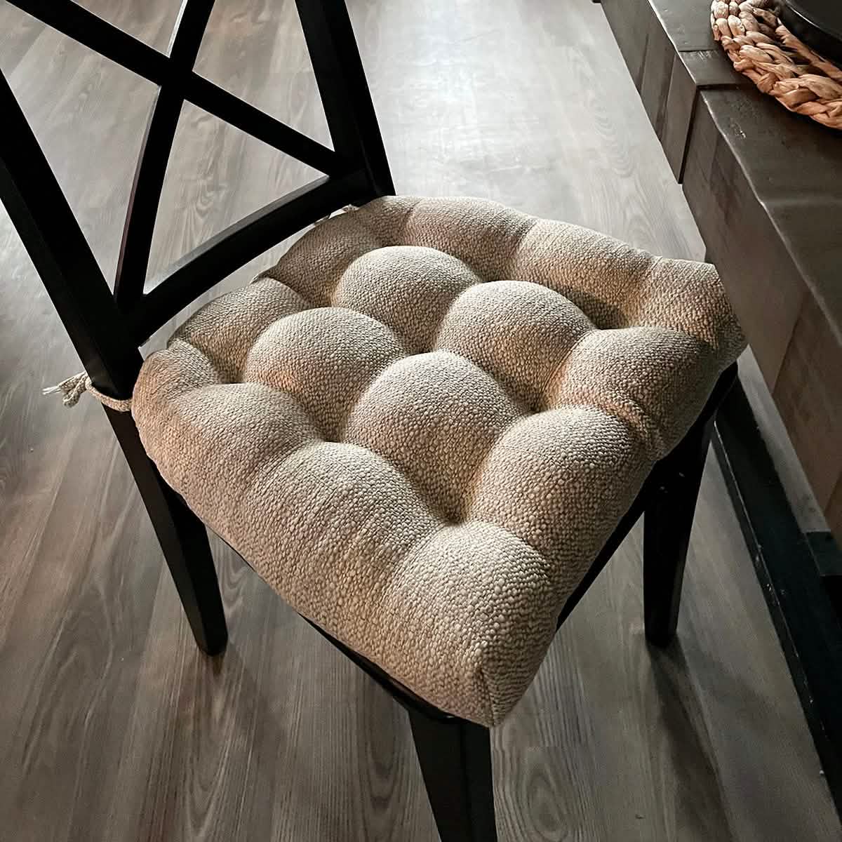 ivory dining chair cushion on black dining chair in contemporary dining room design