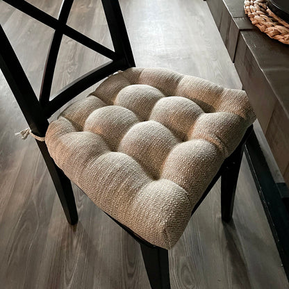 ivory dining chair cushion on black dining chair in contemporary dining room design