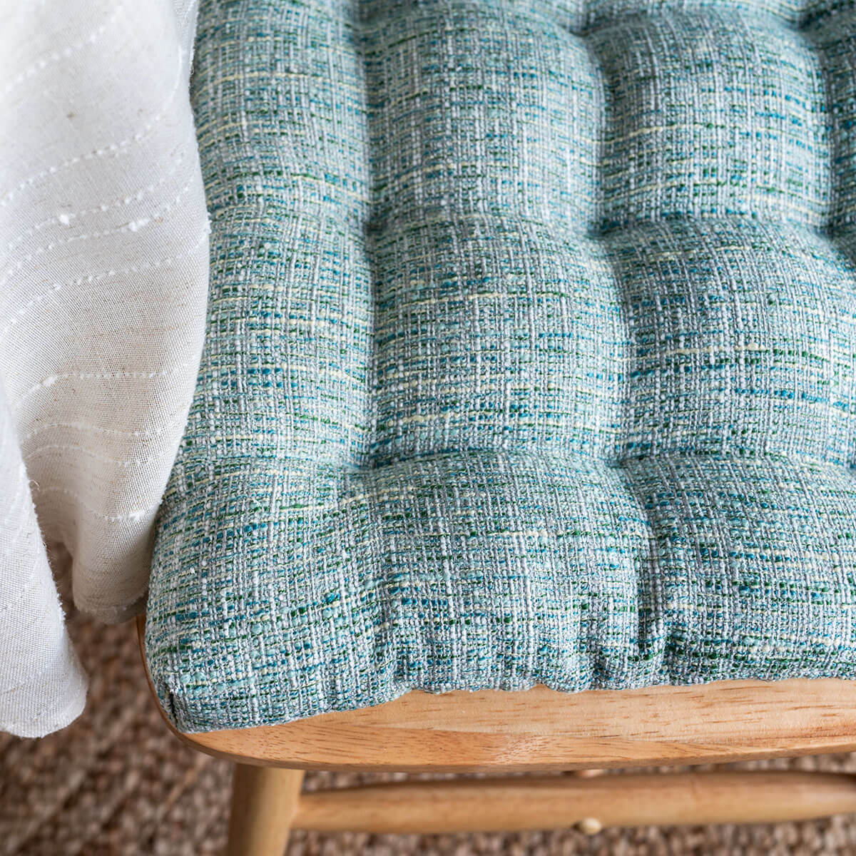 closeup of boucle texture brisbane sea glass dining chair cushions