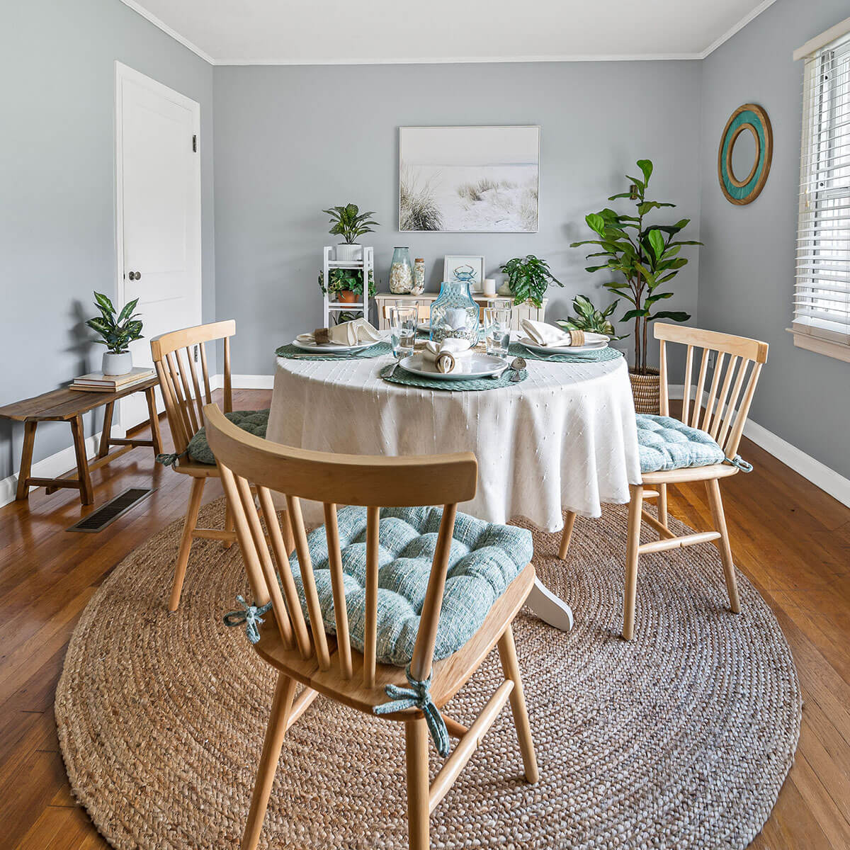 brisbane boucle chair pads on natural wooden chairs in coastal dining room