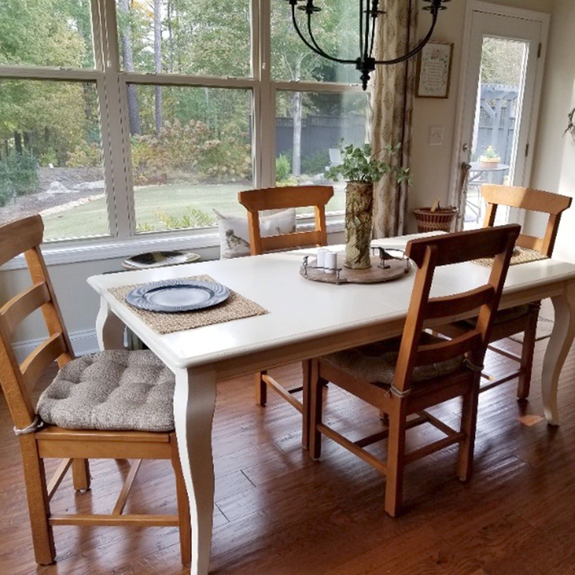 mid-century dining room chairs with neutral beige dining chair cushions