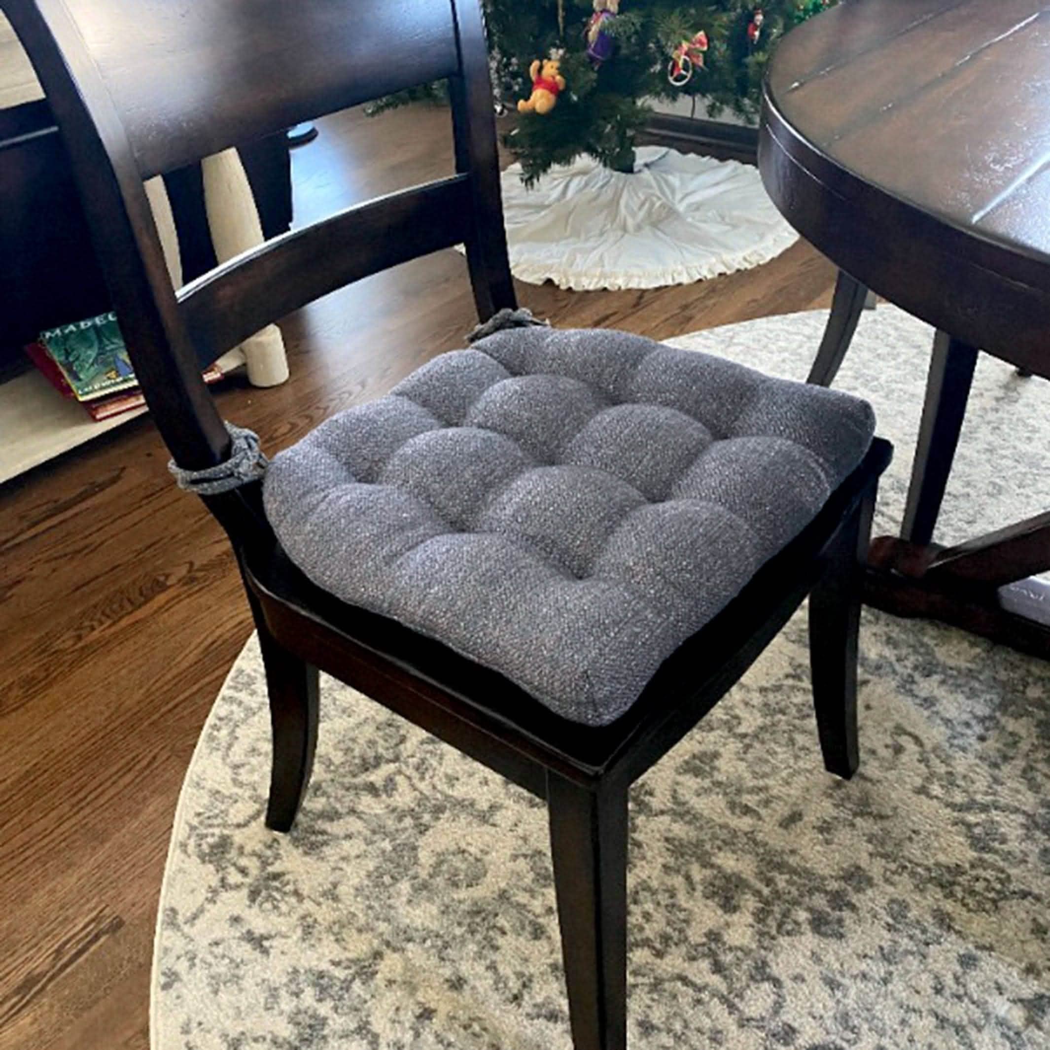 colonial blue dining chair cushion on black dining chair in formal dining room