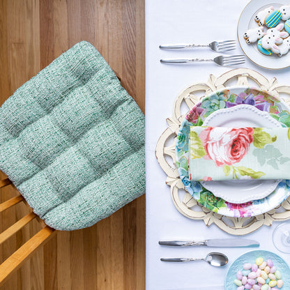 aqua dining chair cushions at dining table decorated for easter