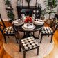 buffalo check dining chair cushions on black dining chairs in formal dining room