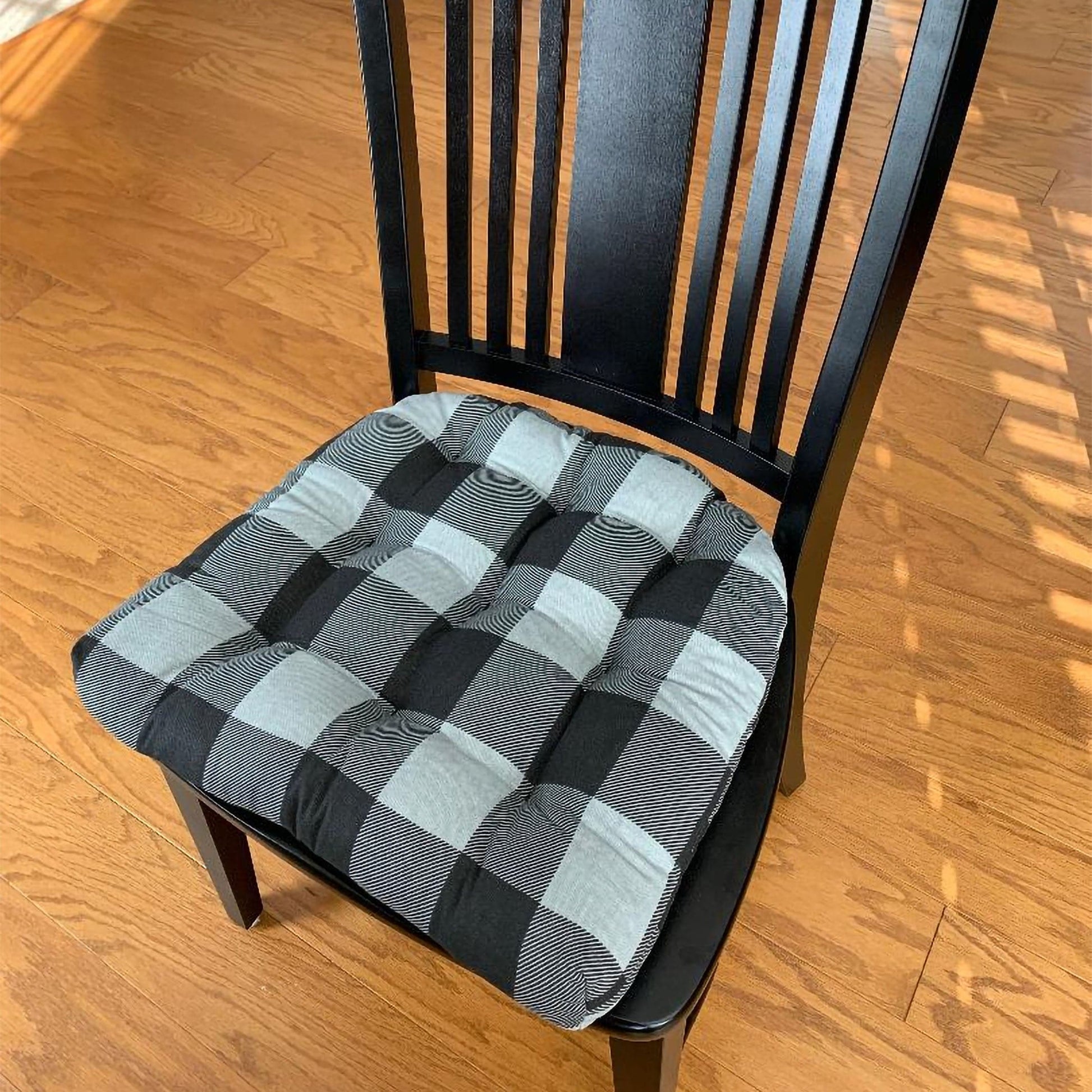 Barnett Home Decor Buffalo Black and Grey Dining Chair cushions on black dining room chair