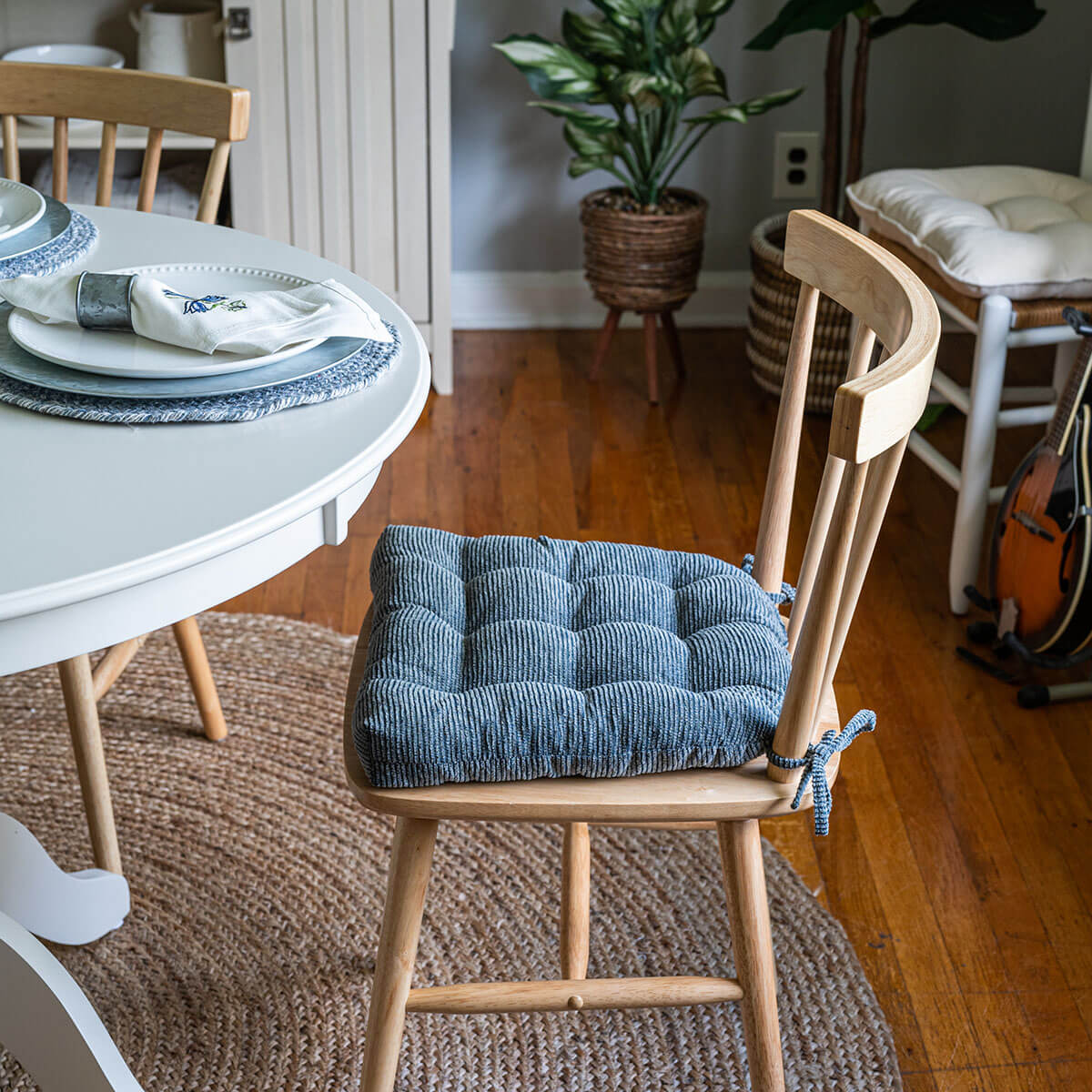 slate gray dining room chair cushions with ties on a wooden dining chair in traditional dining room