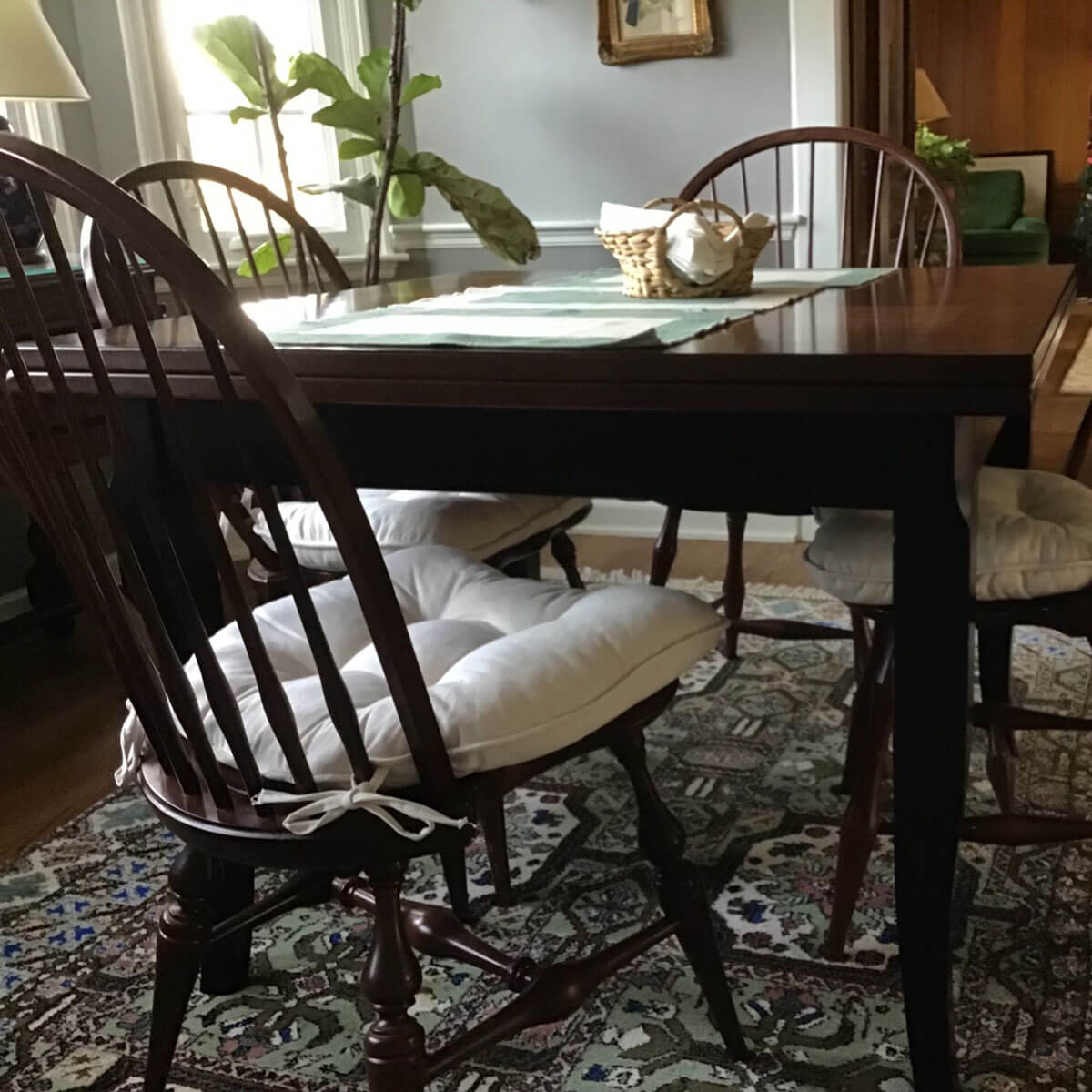 thick chair cushions of natural cotton on windsor chairs in traditional dining room
