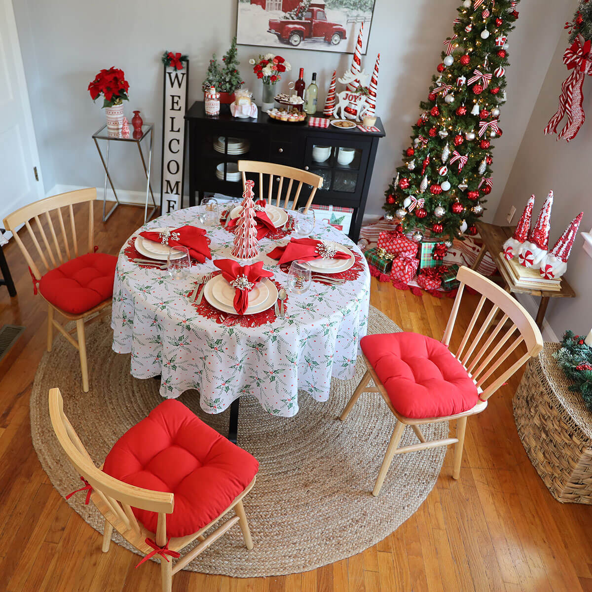 red chair pads in dining room decorated for christmas with candy cane theme