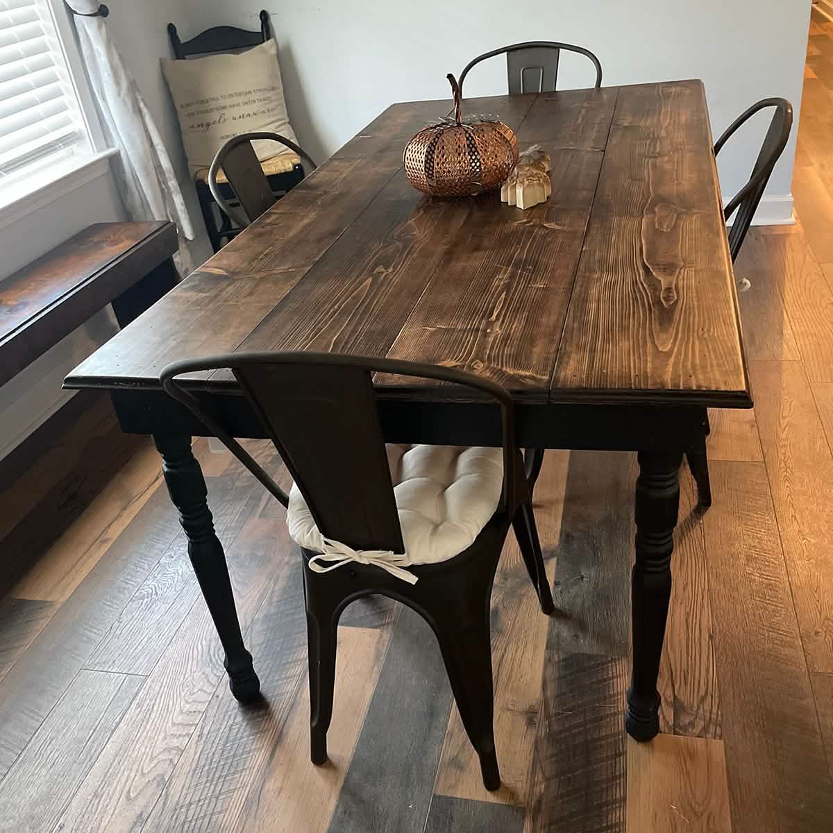 white cotton chair pads for metal chairs in farmhouse dining room decorated for thanksgiving