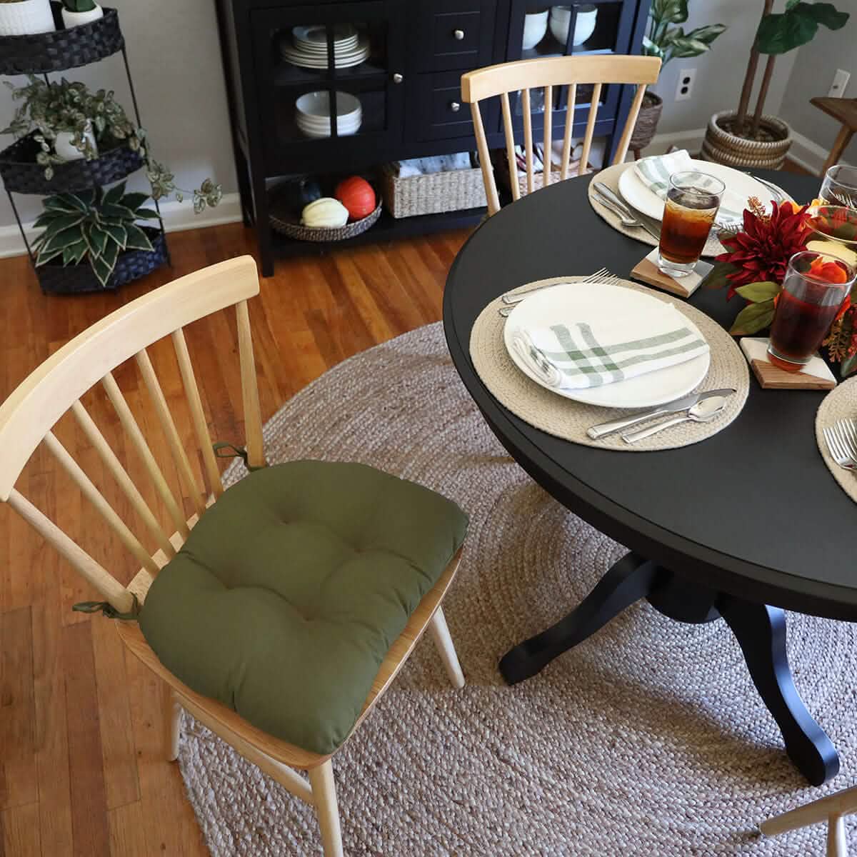 moss green chair pads in formal dining room decorated for fall colours