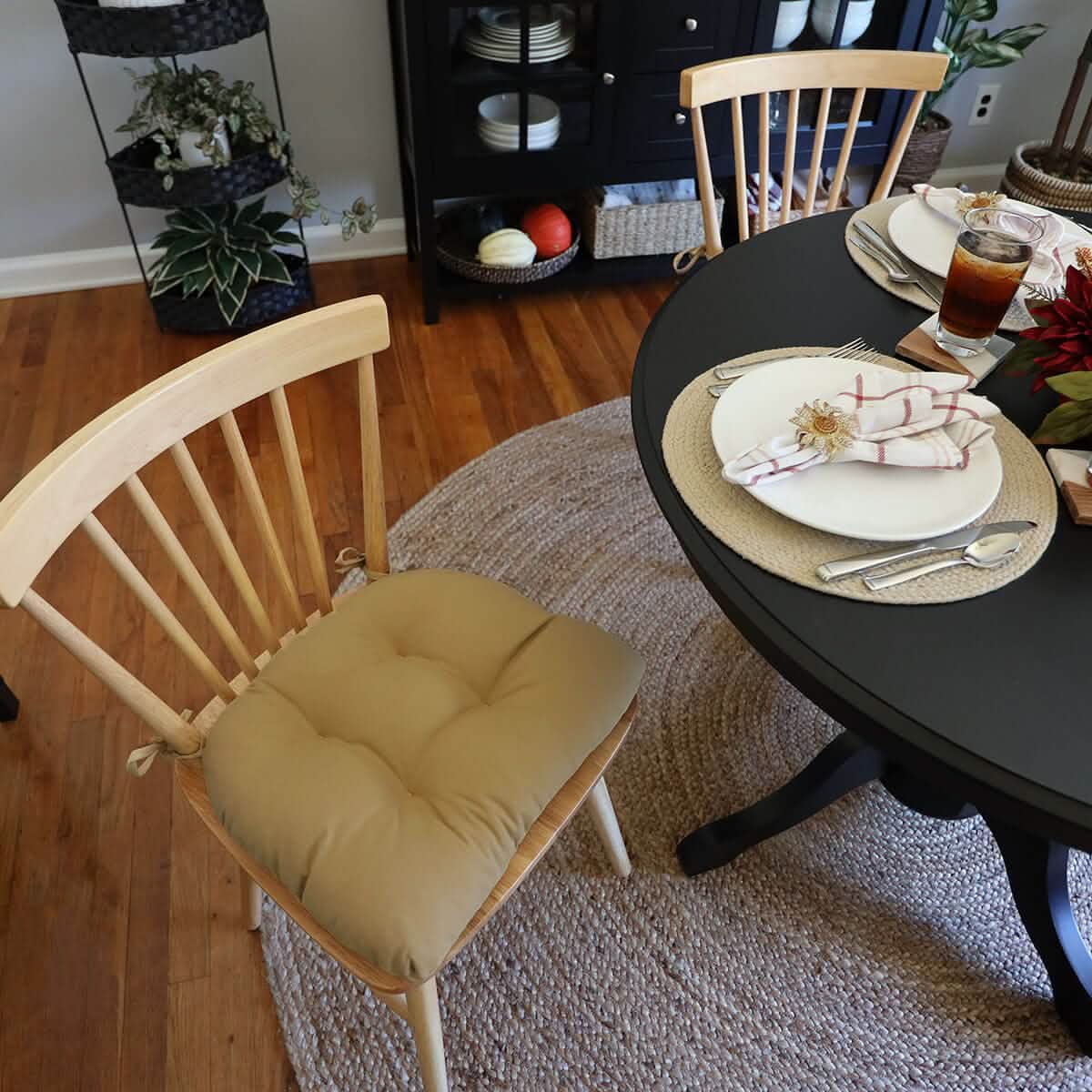 neutral colored tan chair pad on wooden dining room chairs