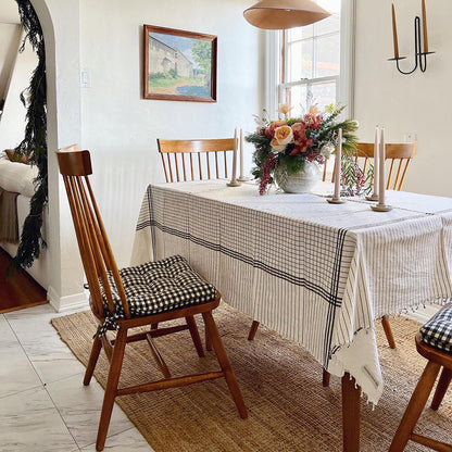 black and white checkered chair pads on dining room chairs in farmhouse style dining room