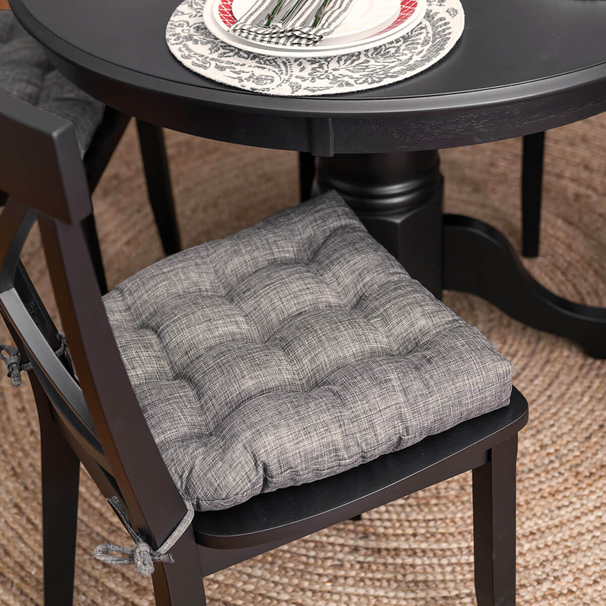 grey dining room chair cushion with linen texture on black dining set