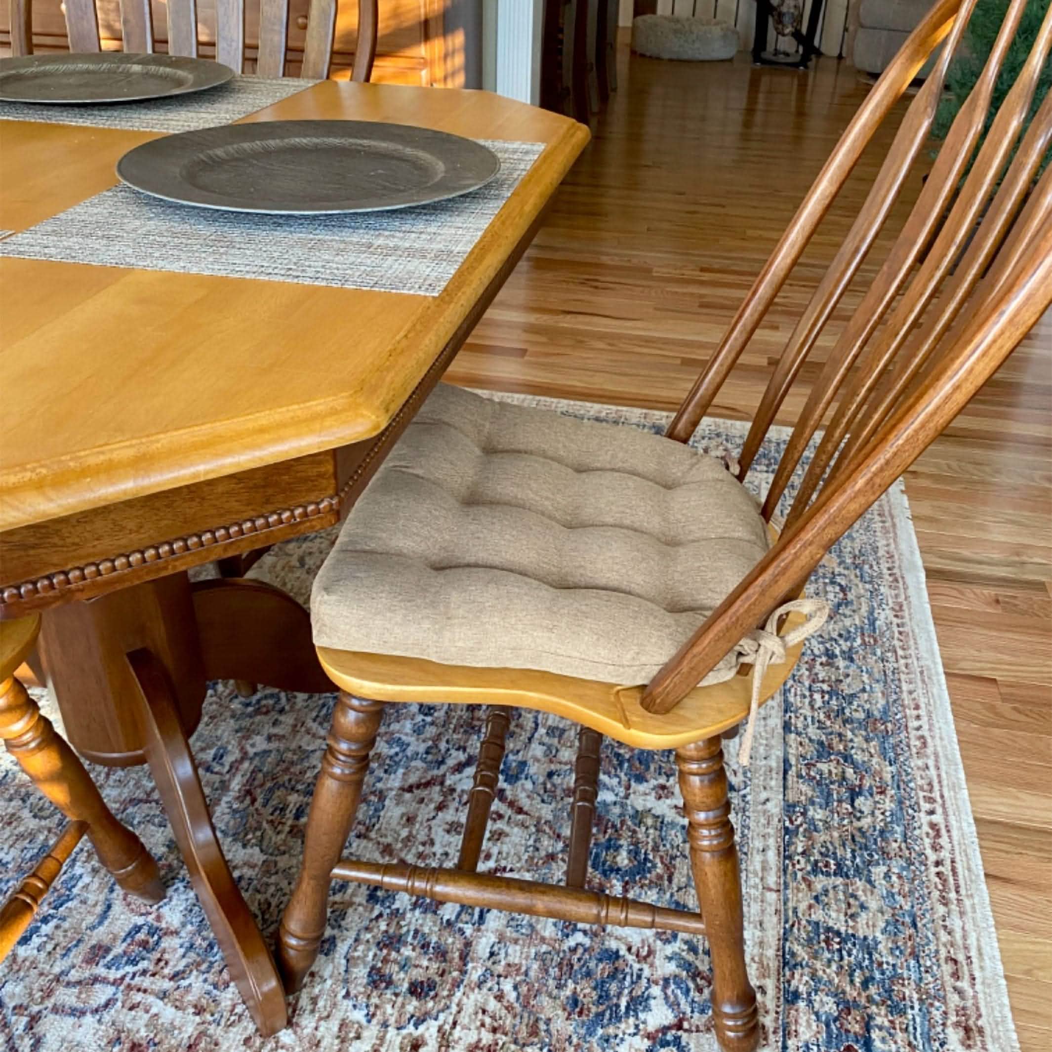 neutral colored dining room chair cushion in traditional dining room