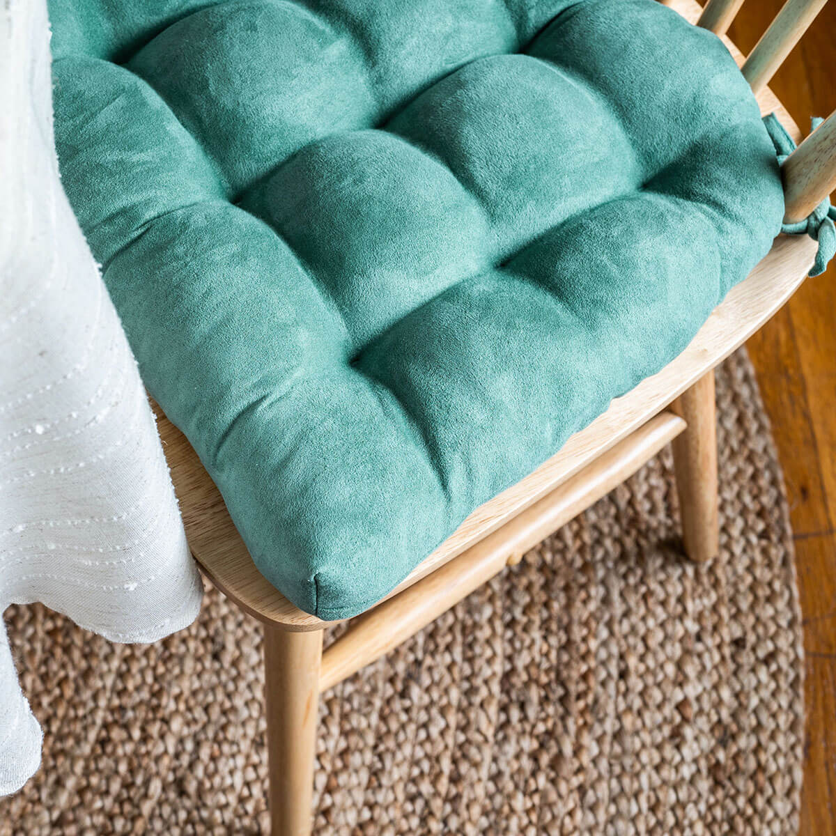 close up detail view of turquoise vegan suede dining room chair cushions