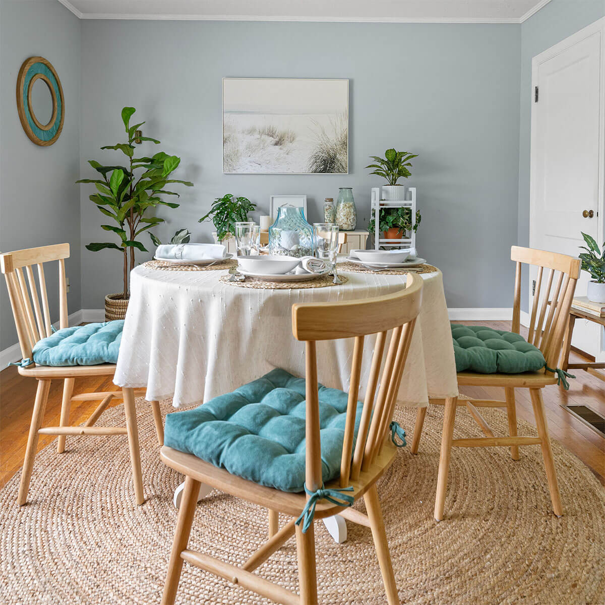 aqua dining chair cushions on natural dining chairs in coastal dining room