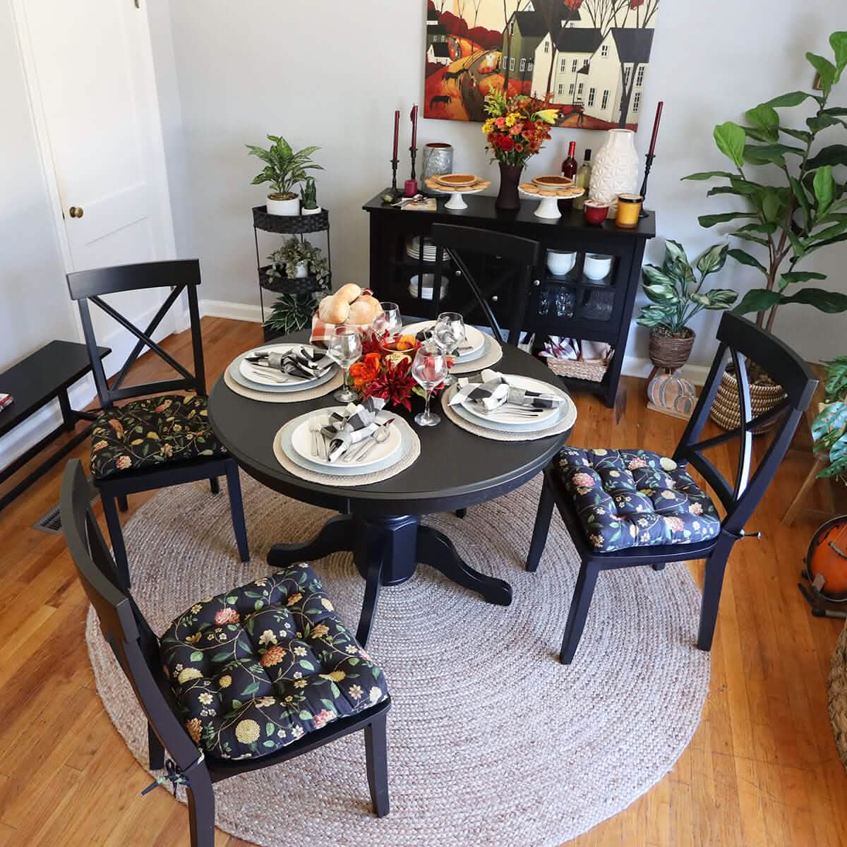 Nassau Vine Onyx Black dining chair pad displayed on wooden chair showing traditional Americana floral design