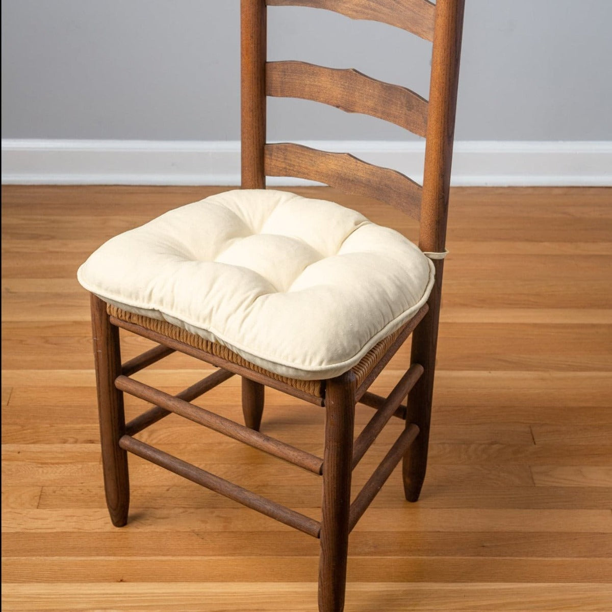 natural cotton chair pads on ladder back chair with cane seat in extra-thick cushion with ties
