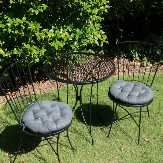 gray cushions for round chairs on bistro set outdoors