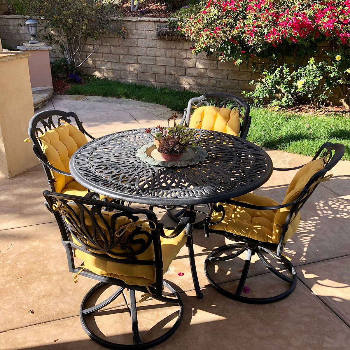 rave yellow outdoor dining chair cushions on wrought iron patio dining set