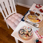 red and white striped dining chair pads on white dining room chairs with patriotic dining room decorations