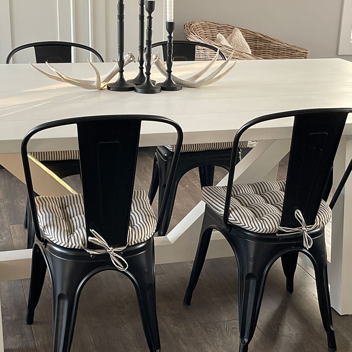 metal chair cushions on black tolix chairs at a farmhouse table