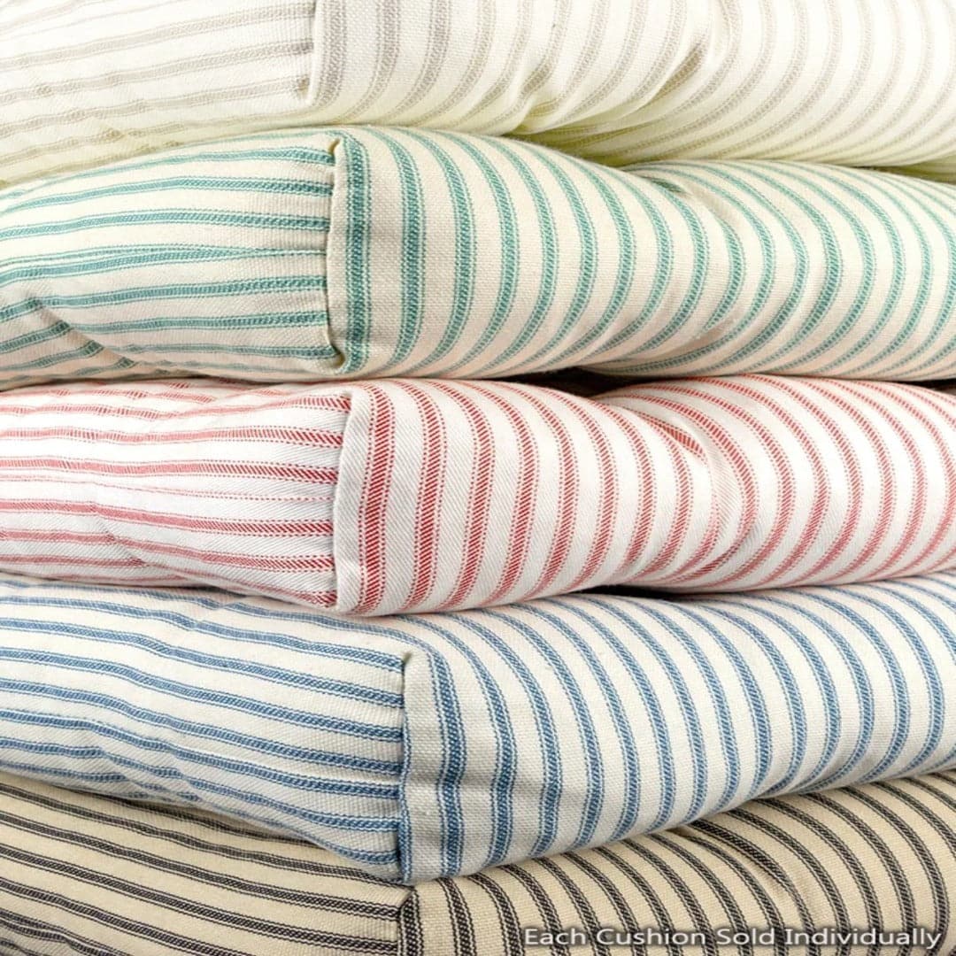 ticking chair cushions in a stack of different colored striped chair cushions