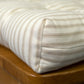 closeup detail of neutral colored dining cushion with box corners