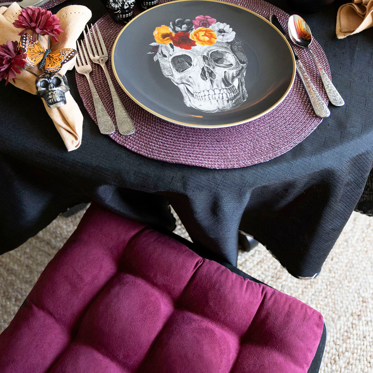 microsuede wine dining chair cushions with halloween tablescape of skull plates skull forks and skull napkin rings